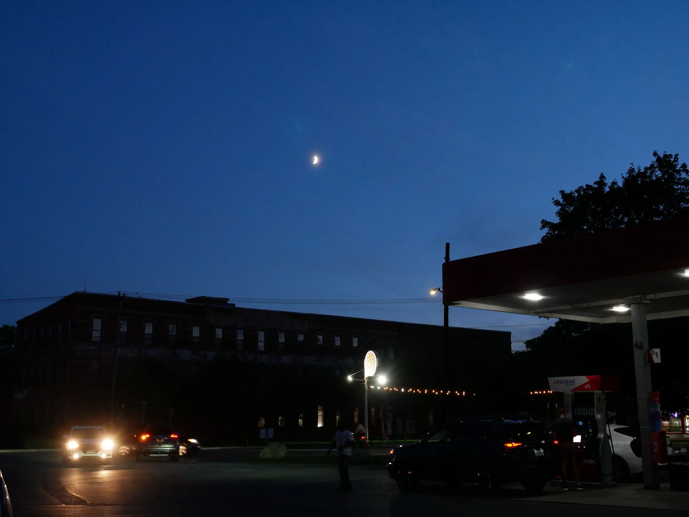 The moon setting over the old organ and piano factory